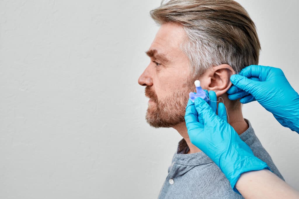 Man getting custom hearing protecction at a local hearing center